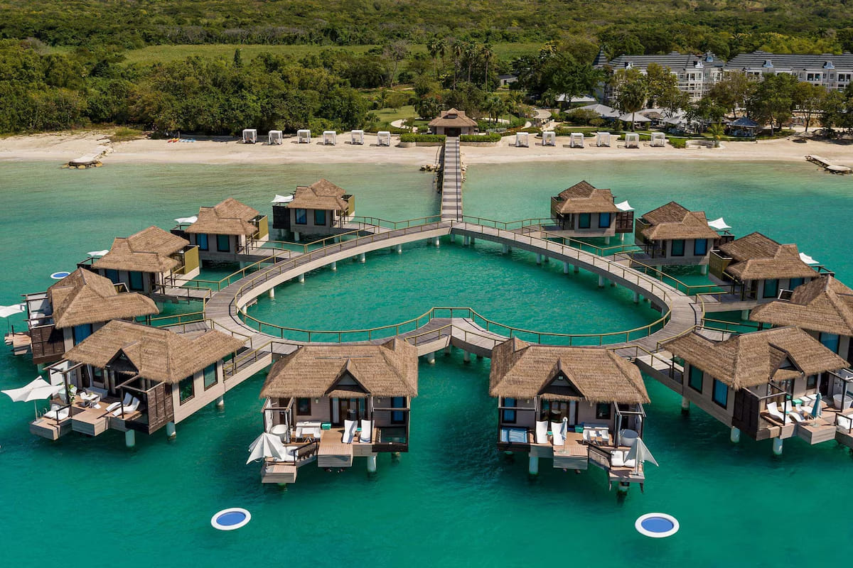 Sandals South Coast overwater villas connected to the Jamaican shoreline